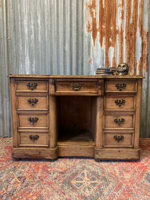 A Victorian limed oak pedestal desk