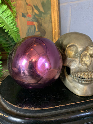 A pink glass witch's ball