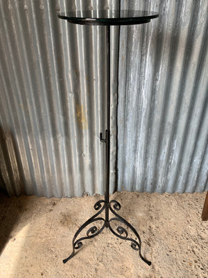 A black cast iron garden wine table or stand