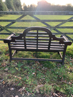 A large Lutyens wooden bench