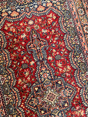 A Persian red ground runner - 340cm
