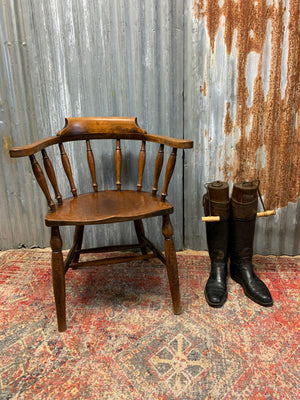 A pair of bow back captain's chairs