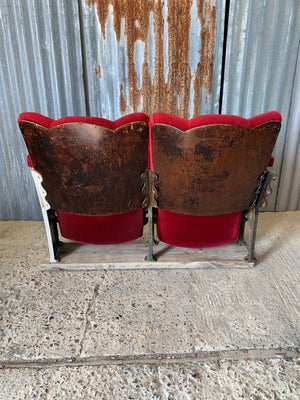 A pair of Art Deco red velvet flip cinema or theatre seats