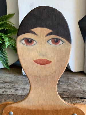 A wooden 2D flat female mannequin cut out