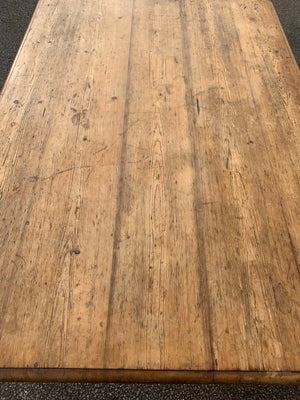 A Victorian scrubbed pine kitchen or dining table on castors