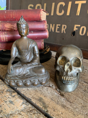A bronze seated Buddha figure