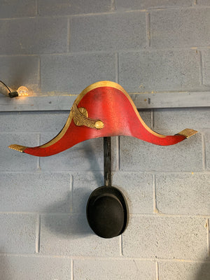 A toleware bicorn hat trade sign