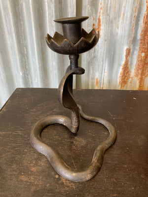 A pair of Indian or North African bronze cobra candlesticks