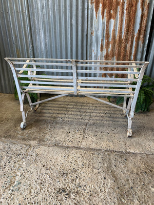 A Victorian cast iron strapwork bench