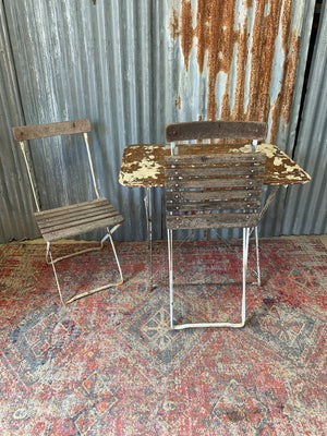 A white metal folding garden set - table and two chairs