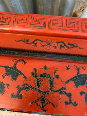 A red lacquer chinoiserie coffee table