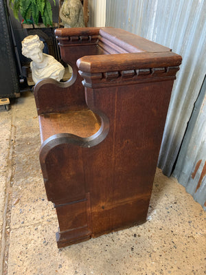 A small wooden 19th century church pew