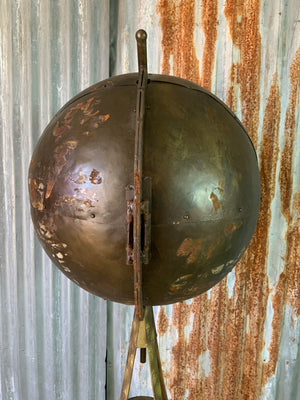A large vintage industrial style globe drinks bar