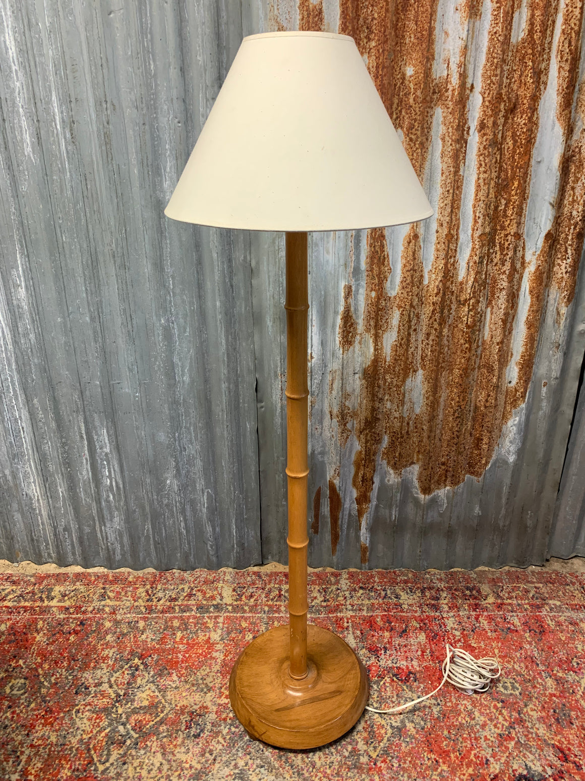 A faux bamboo floor lamp