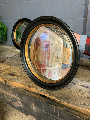 A large black and gold convex mirror ~ 44.5cm