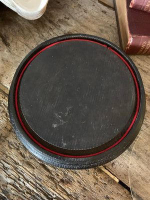 An ebonised glass dome