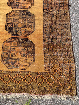 A gold Persian rectangular rug