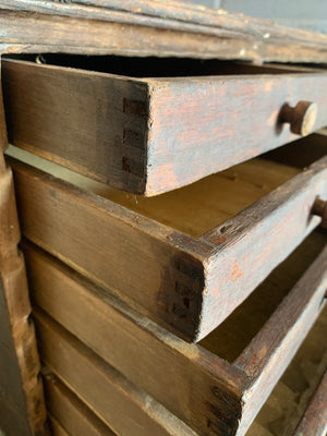 A bank of wooden ‘Lion and Wreath Trademark’ haberdashery draws