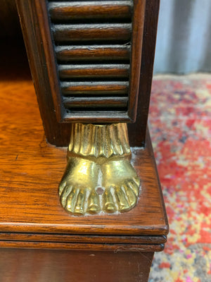 An empire style bookcase with Egyptian motifs