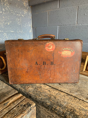 A brown leather suitcase by W W Bridge Ltd