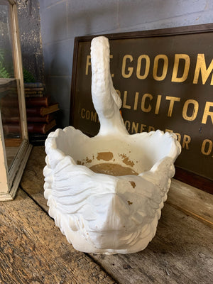 A very large faux stone swan planter
