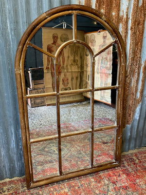 A large window frame mirror