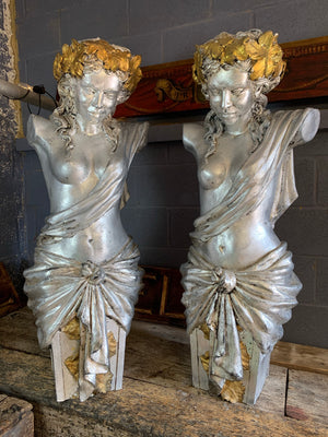 A pair of large life-size nude female pilasters