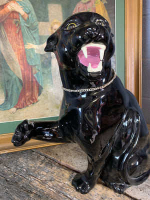 A large ceramic black panther