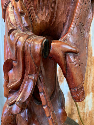 A large carved hardwood lamp depicting Shou Lao