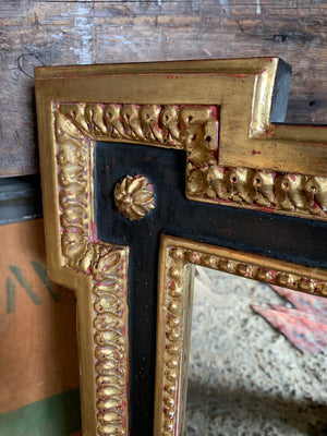 A black and gilt outset or box corner mirror