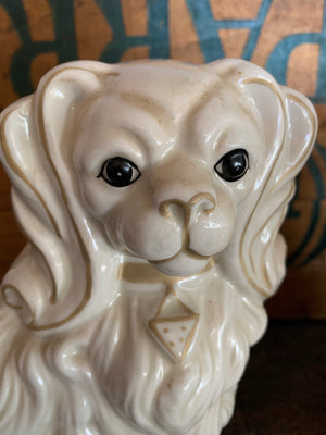 A pair of white ceramic Staffordshire style dogs