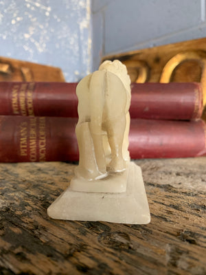 An opposing pair of Grand Tour alabaster Medici lions