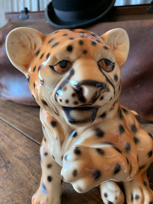 A ceramic Mid-Century leopard cub statue