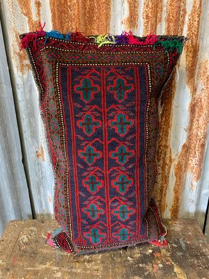 A large rectangular red ground Persian carpet floor cushion