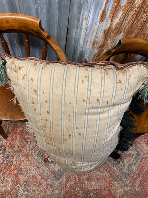 A large rectangular Persian carpet floor cushion