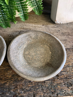A pair of handmade rough hewn marble plates