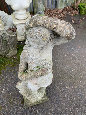 A cast stone statue of Venus