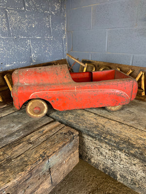 A Tri-ang Thunderbolt child's pedal car