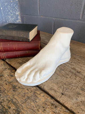 A neoclassical plaster foot of John Tussaud 1873