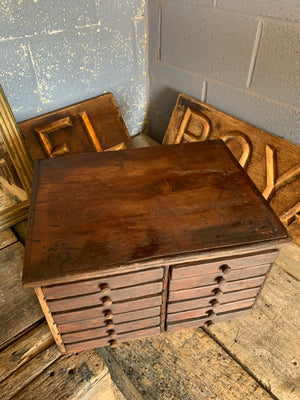 A bank of wooden ‘Lion and Wreath Trademark’ haberdashery draws