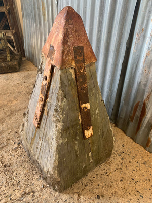 A large salvaged groyne pillar cap with iron work