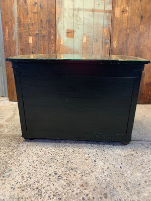 An ebonised credenza with mirrored top