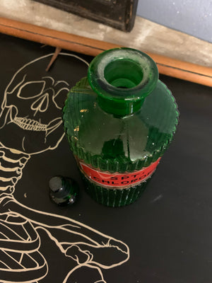 A rare set of three green glass apothecary jars