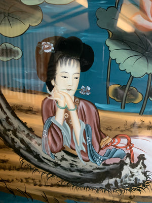 A large reverse painted glass Geisha picture