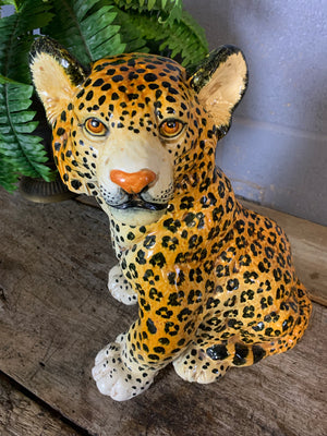 A large Hollywood Regency leopard cub statue