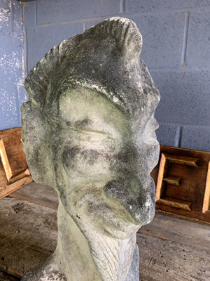 A large cast stone bust of Mephistopheles