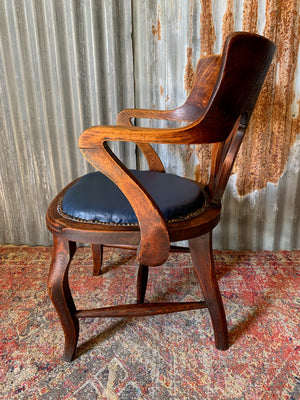 An oak banker's desk chair