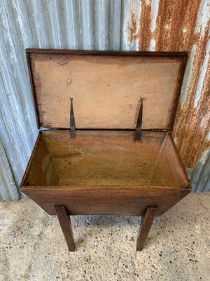 An early wooden dough bin raised on legs