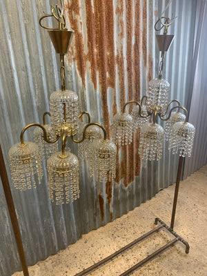 A five arm brass Hollywood Regency chandelier