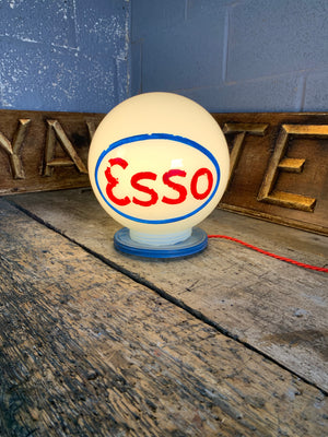 An Esso gas pump globe table lamp